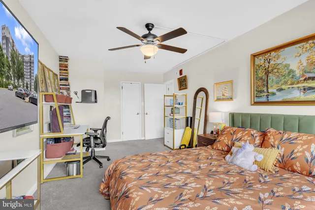 a bed room with a bed and a chair