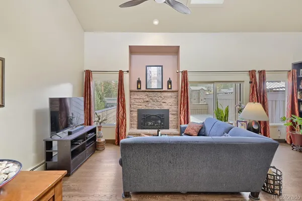 a living room with furniture and a fireplace