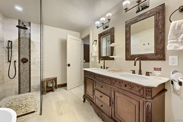 a bathroom with a sink double vanity and a mirror
