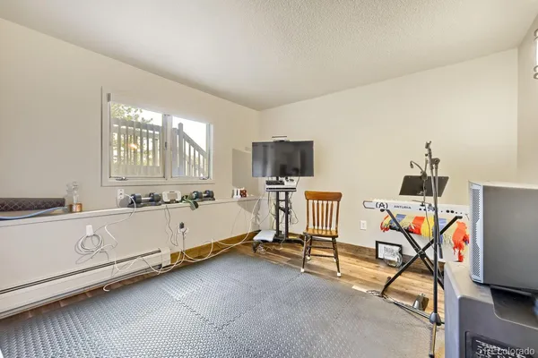 a room with furniture and flat screen tv