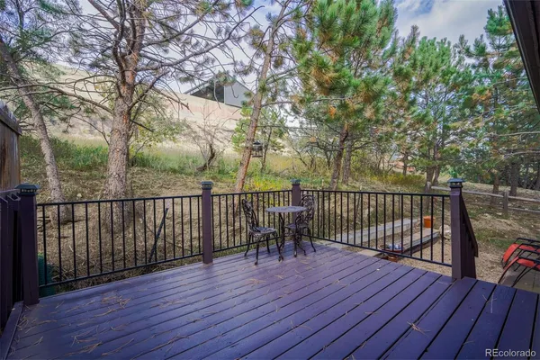 a view of deck with wooden floor and outdoor seating