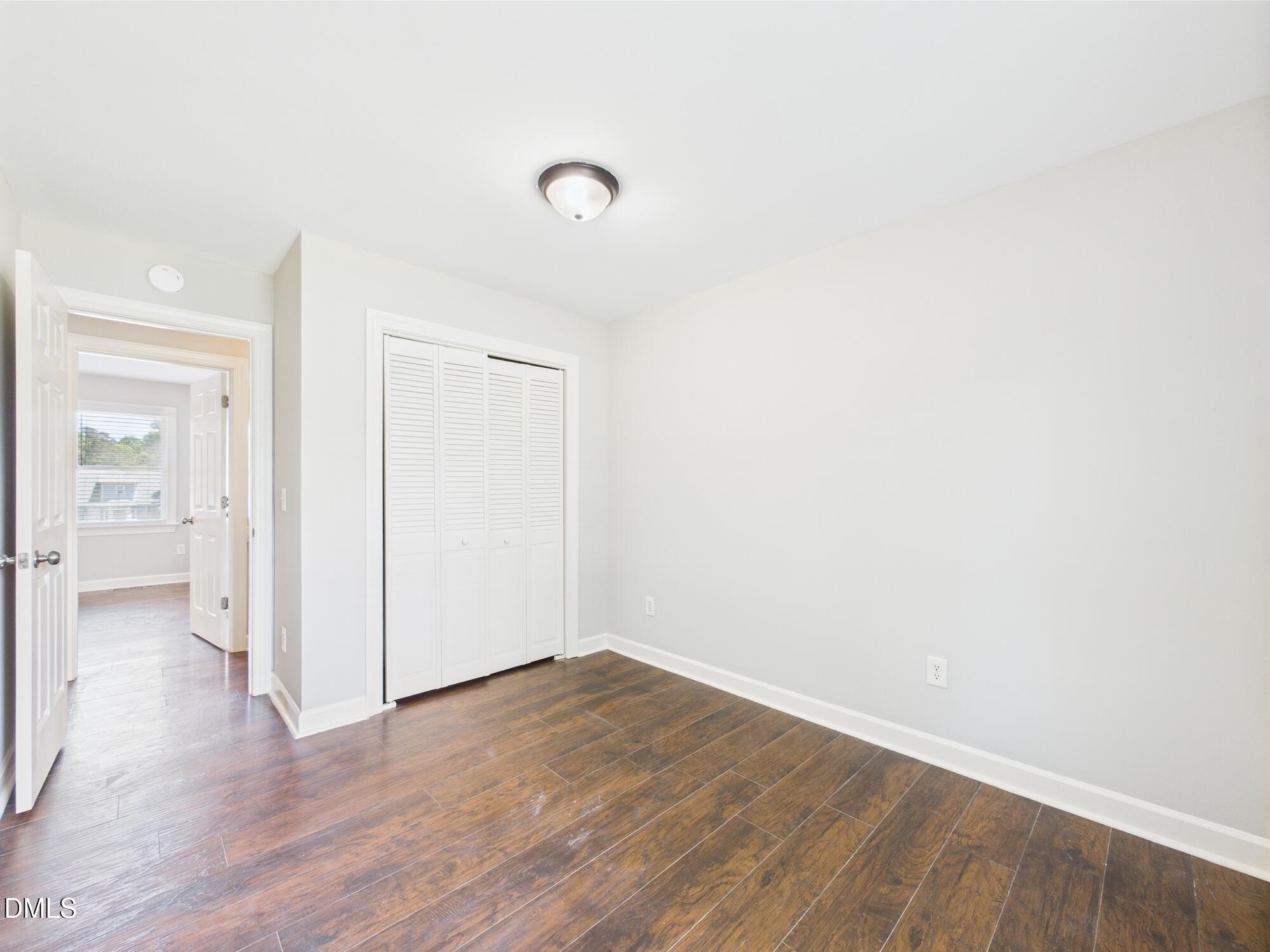 10917 Fanny Brown Road Raleigh, NC 27603 - Photo 38 of 54 a view of a room with wooden floor and a bathroom