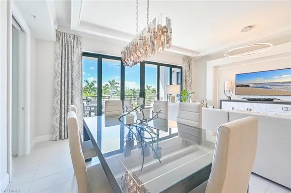 a kitchen with a cabinets and chairs in it