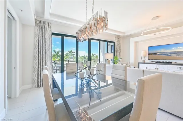 a kitchen with a cabinets and chairs in it