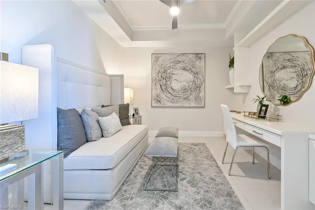 a living room with furniture and a large mirror