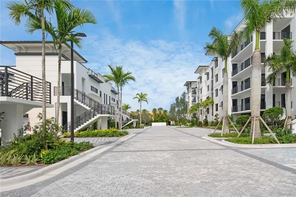 a view of a palm trees in front of a building
