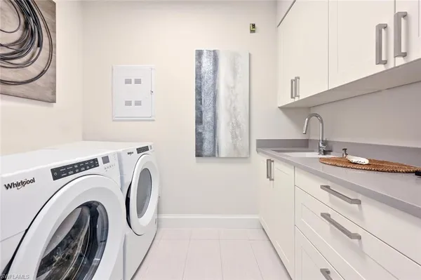 a living room with patio furniture and a floor to ceiling window