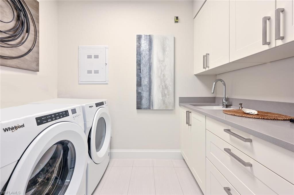 1111 Central Avenue, Unit 303 Naples, FL 34102 - Photo 25 of 50 a utility room with dryer and washer