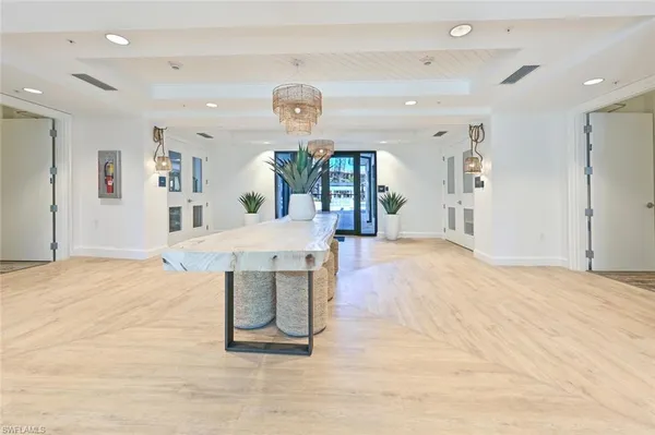 a bedroom with a bed and a lamp