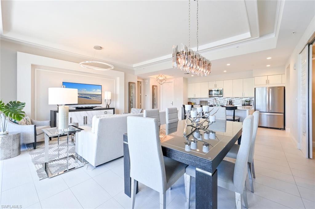 1111 Central Avenue, Unit 303 Naples, FL 34102 - Photo 10 of 50 a view of a dining room with furniture window and outside view