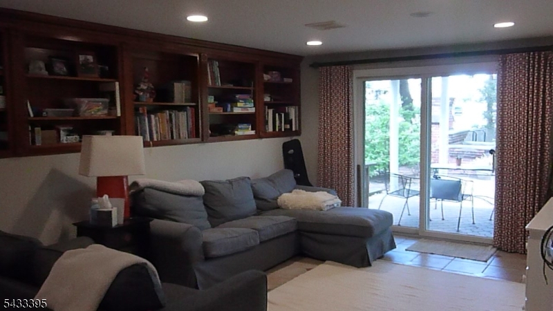 48 Woodmont Road Montclair, NJ 07043 - Photo 17 of 20 a living room with furniture and a floor to ceiling window