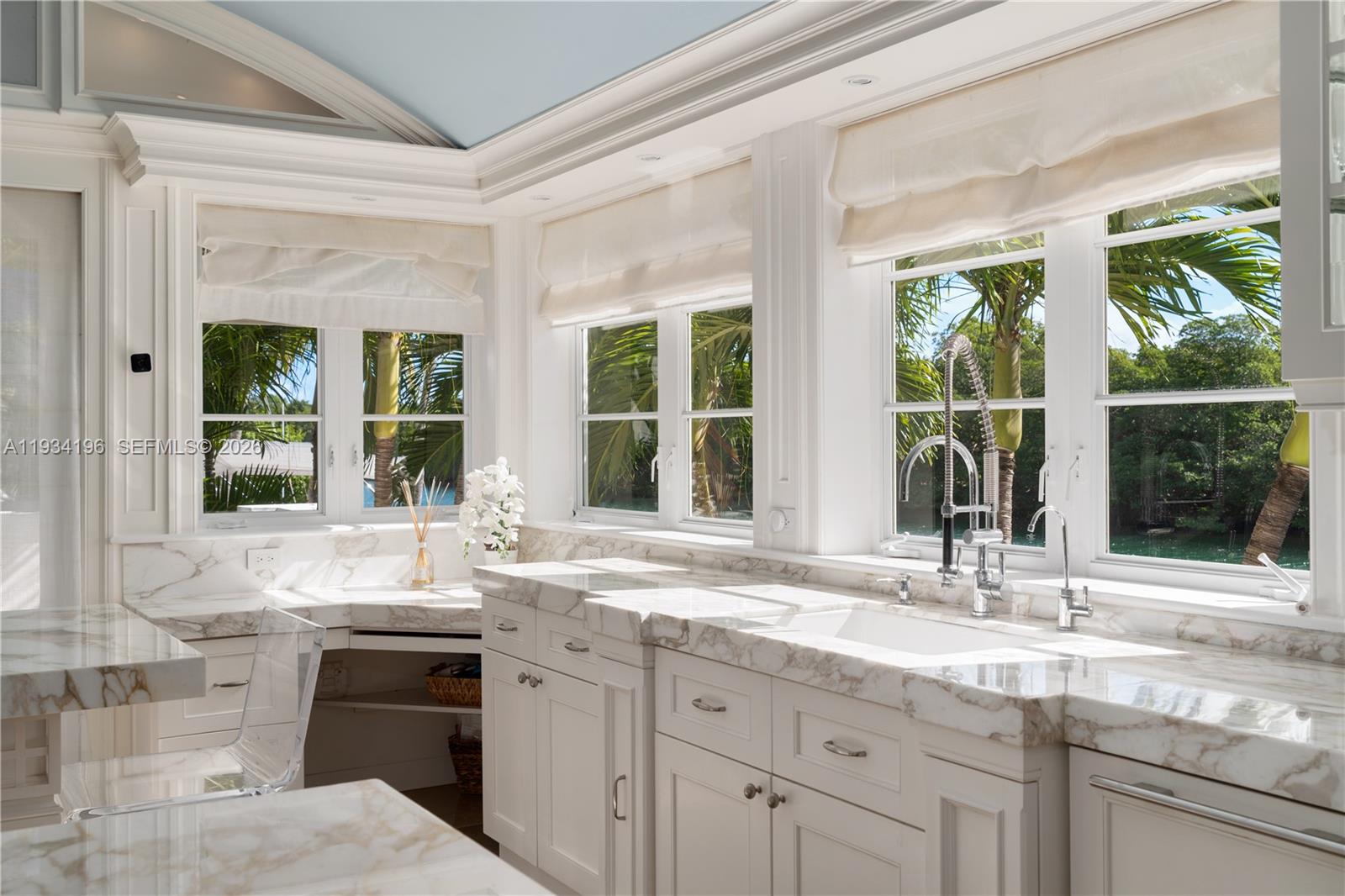 100 Cape Florida Drive Key Biscayne, FL 33149 - Photo 19 of 68 a kitchen with granite countertop a sink and a window