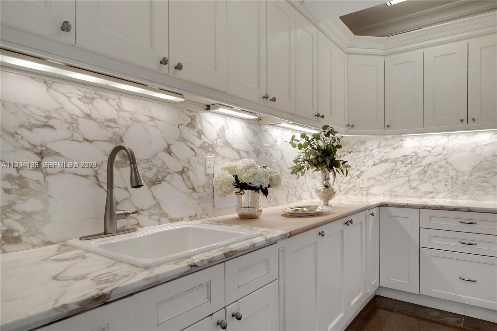 100 Cape Florida Drive Key Biscayne, FL 33149 - Photo 21 of 68 a bathroom with a sink and mirror