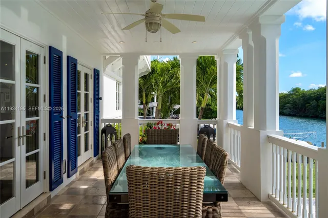 a living room with furniture and a large mirror