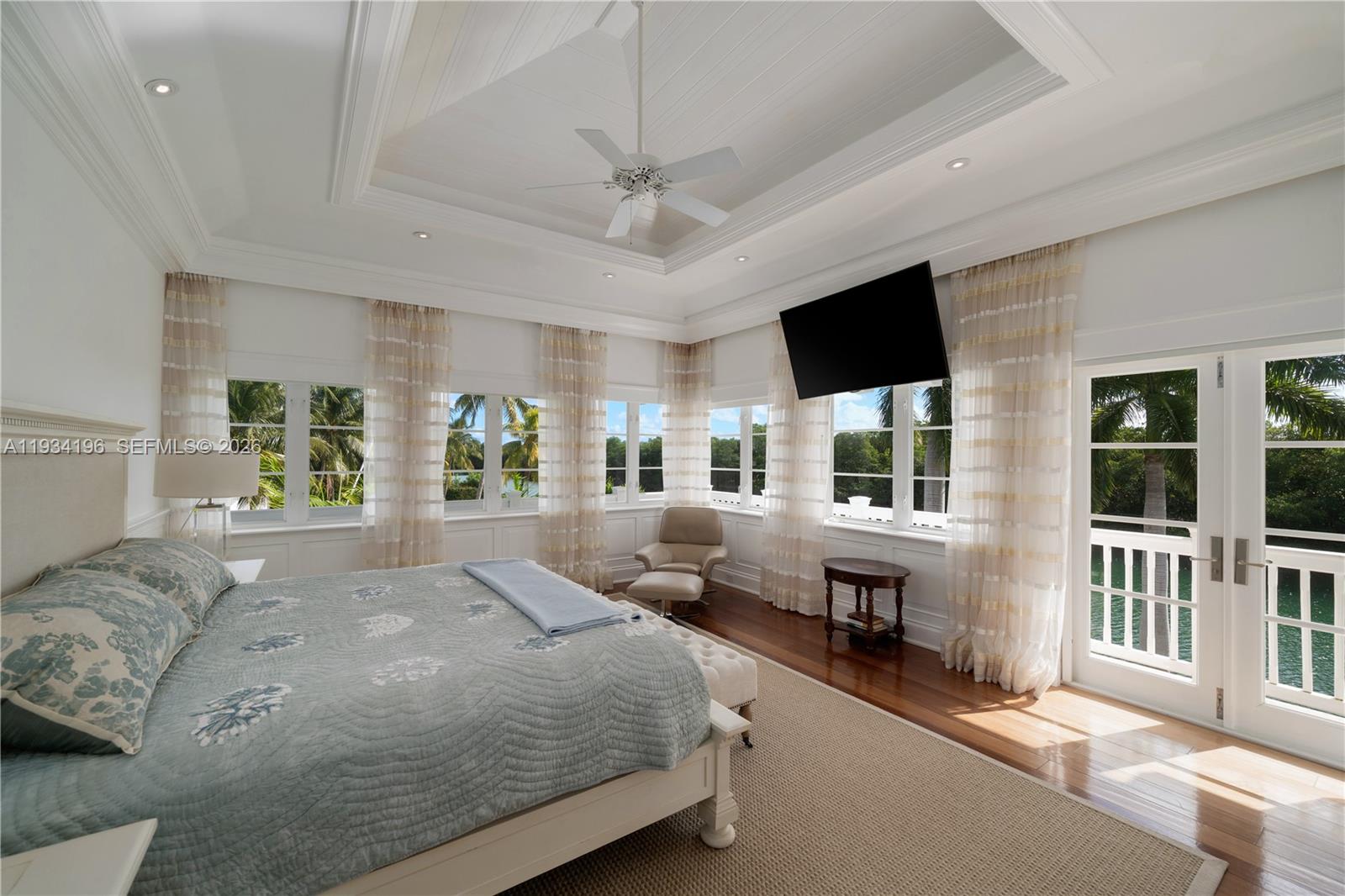 100 Cape Florida Drive Key Biscayne, FL 33149 - Photo 25 of 68 a spacious bedroom with a bed couch and a window