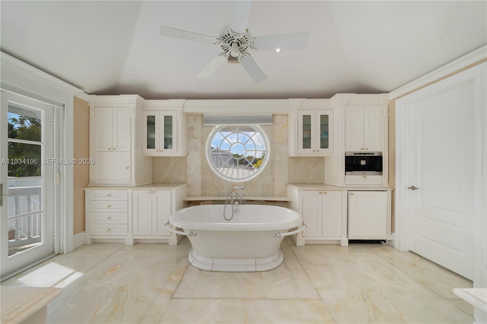 100 Cape Florida Drive Key Biscayne, FL 33149 - Photo 26 of 68 a bathroom with a toilet a sink and mirror