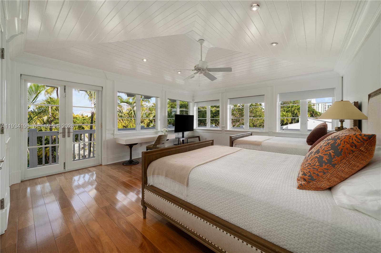 100 Cape Florida Drive Key Biscayne, FL 33149 - Photo 30 of 68 a bedroom with a large bed and a large window