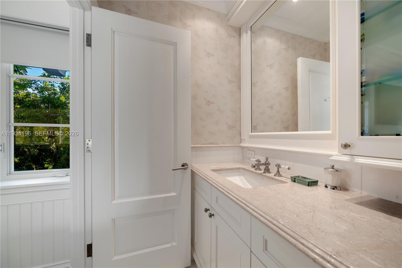 100 Cape Florida Drive Key Biscayne, FL 33149 - Photo 32 of 68 a bathroom with a sink and a mirror