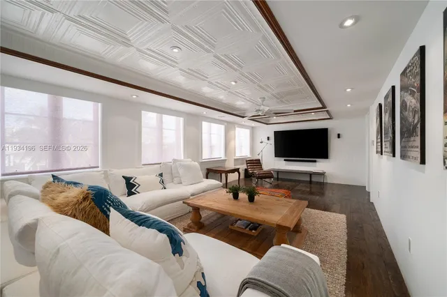 a kitchen with white cabinets and sink