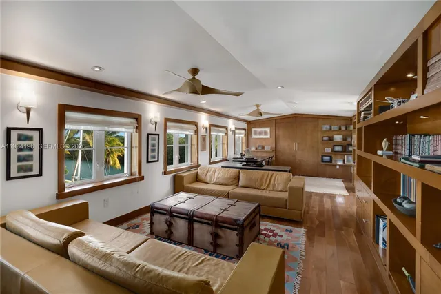 a bed room with a bed and a ceiling fan