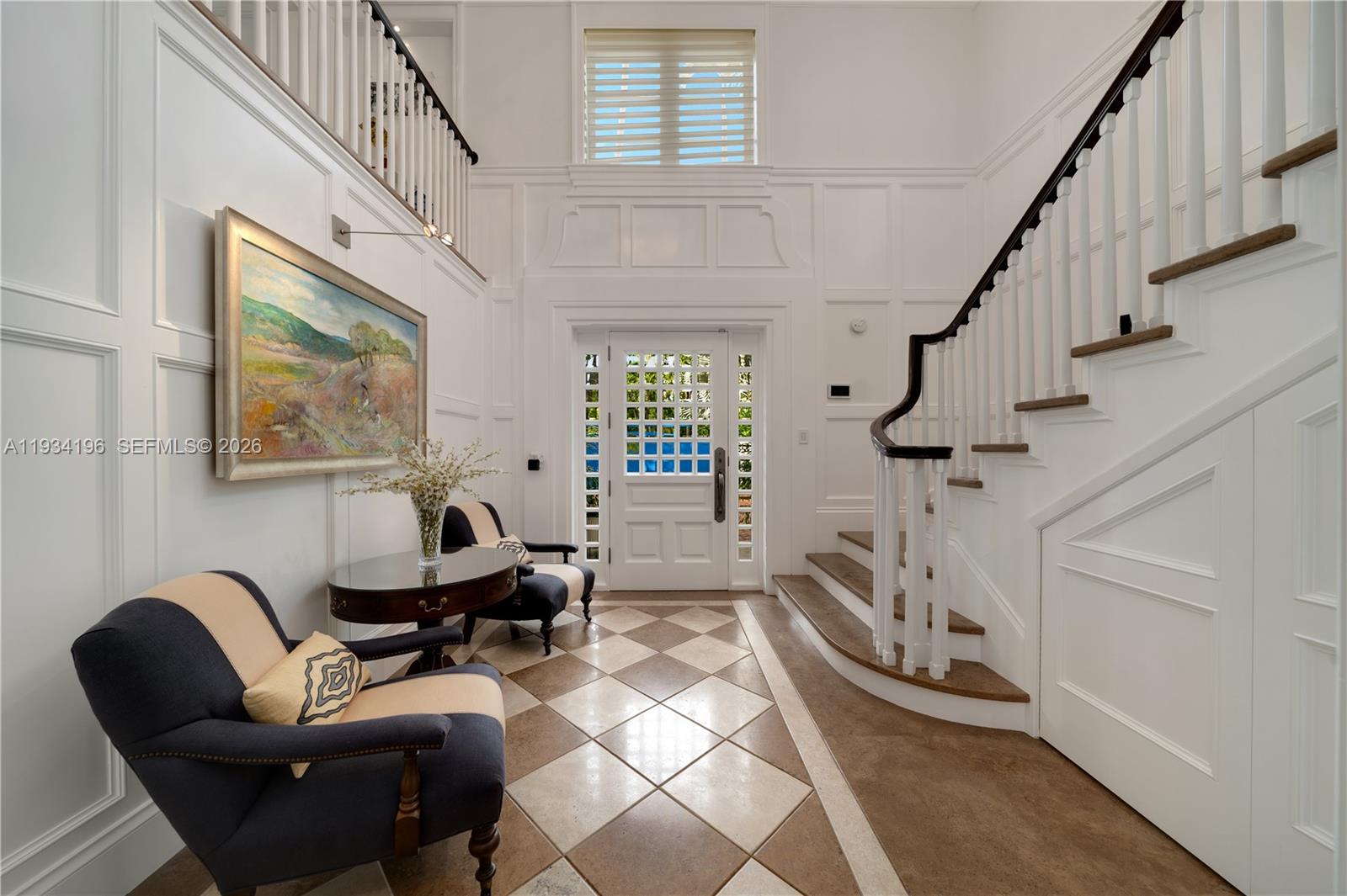 100 Cape Florida Drive Key Biscayne, FL 33149 - Photo 38 of 68 a living room with furniture a fireplace and a floor to ceiling window
