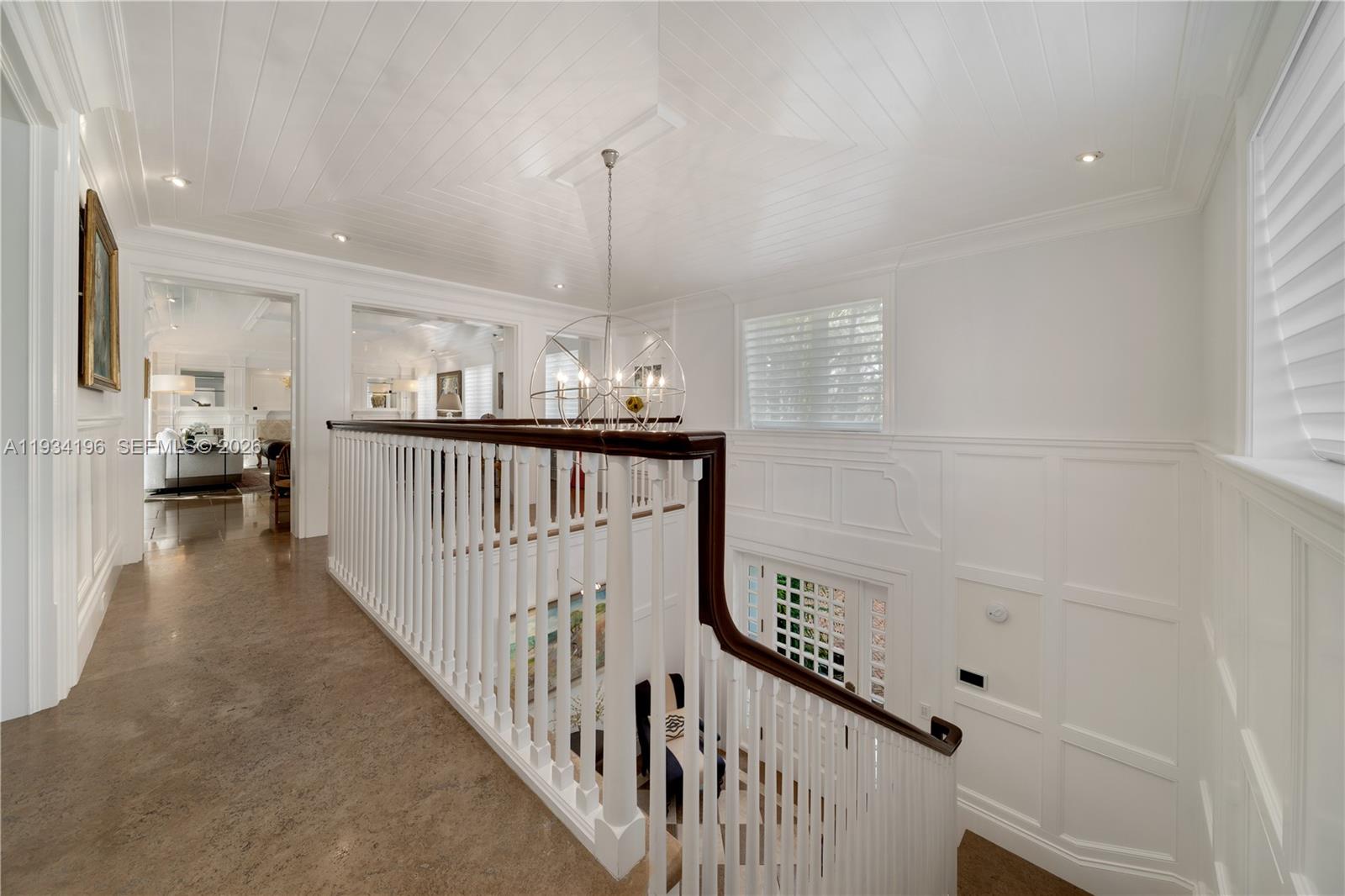 100 Cape Florida Drive Key Biscayne, FL 33149 - Photo 40 of 68 a view of a hallway with the wooden floor and staircase