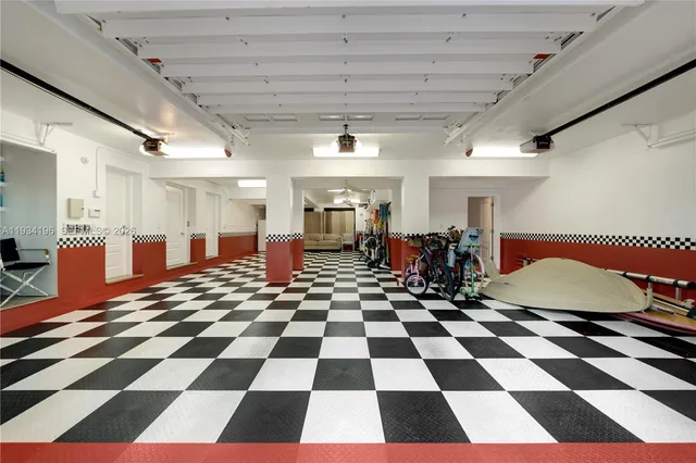 an aerial view of a house with a garden and swimming pool