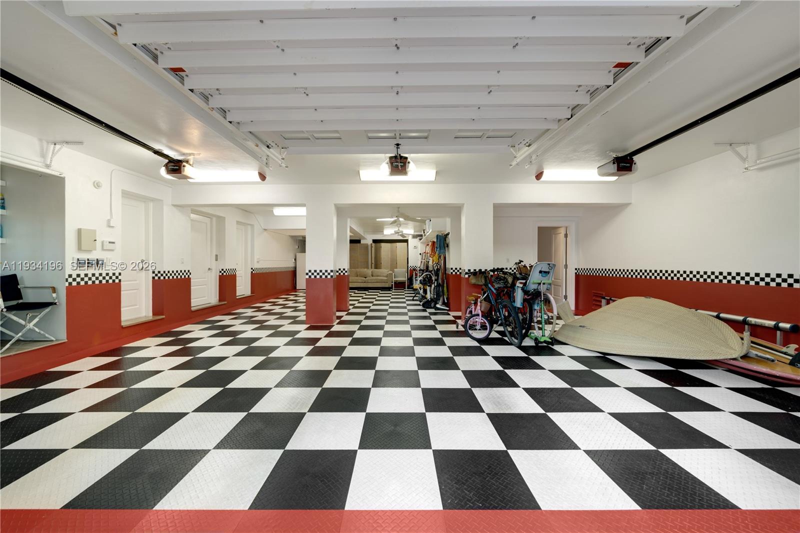 100 Cape Florida Drive Key Biscayne, FL 33149 - Photo 45 of 68 a room with a black white checkered floor with a black white checkered floor and a black white checkered floor