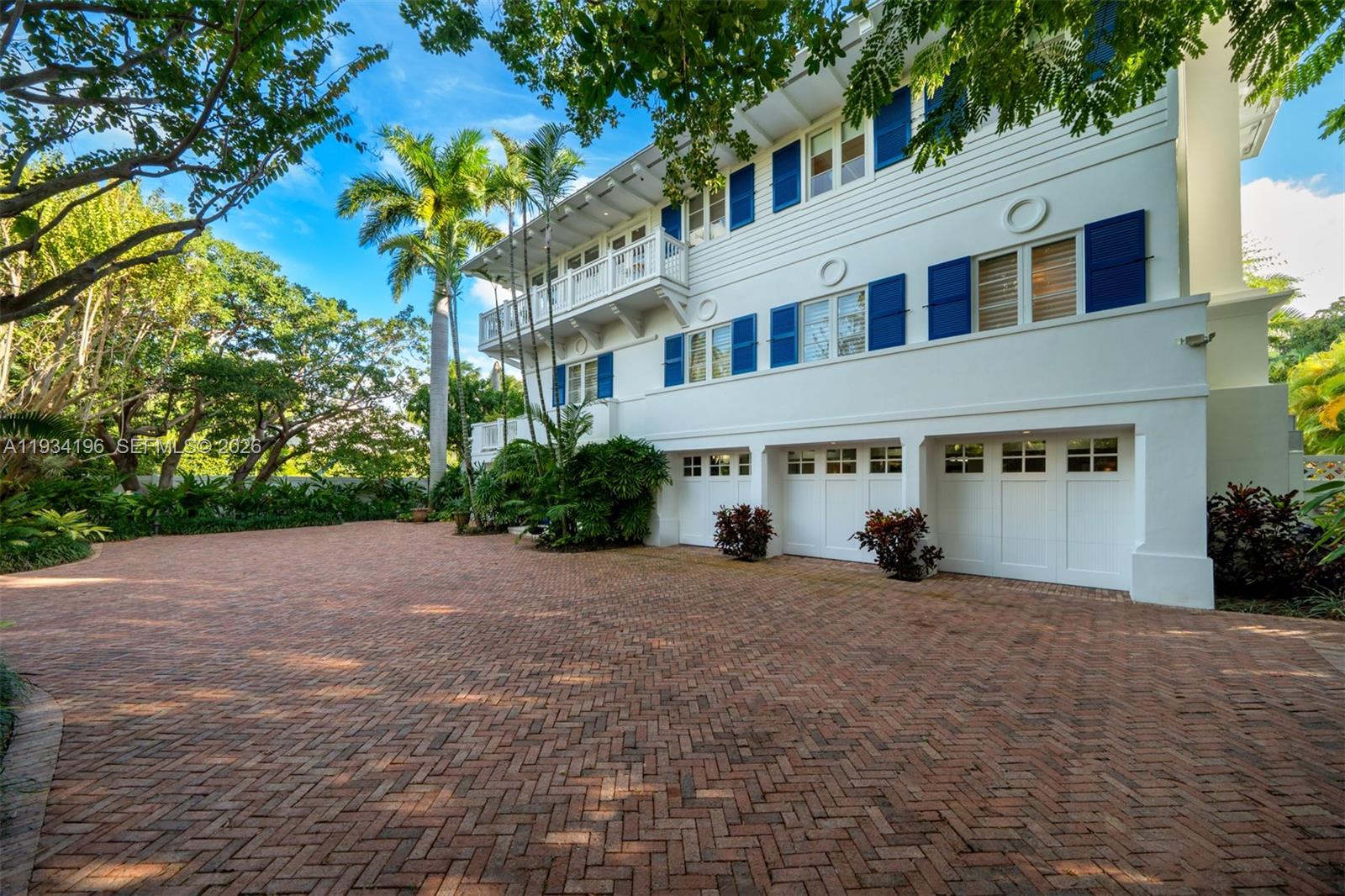 100 Cape Florida Drive Key Biscayne, FL 33149 - Photo 51 of 68 a view of a house with a yard and potted plants