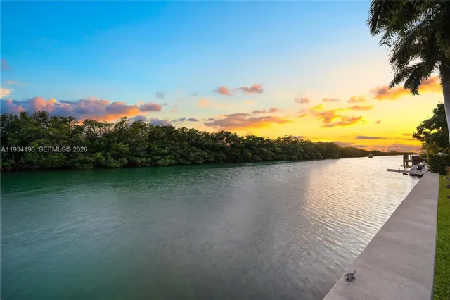 a large kitchen with lots of counter space and windows