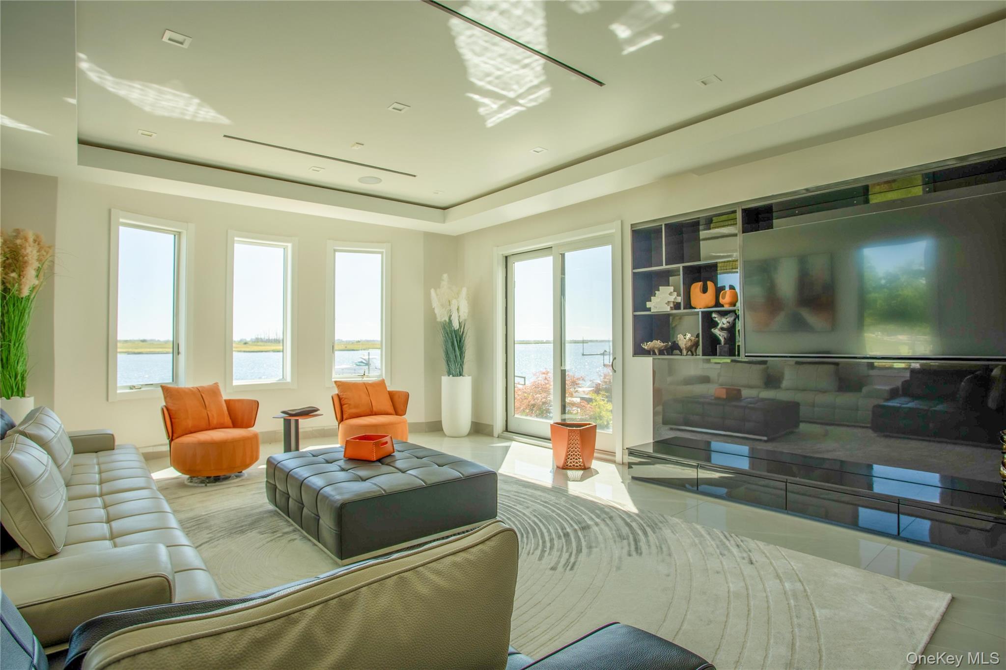 190 Curtis Road Woodmere, NY 11598 - Photo 19 of 45 Tiled living room featuring a tray ceiling and baseboards