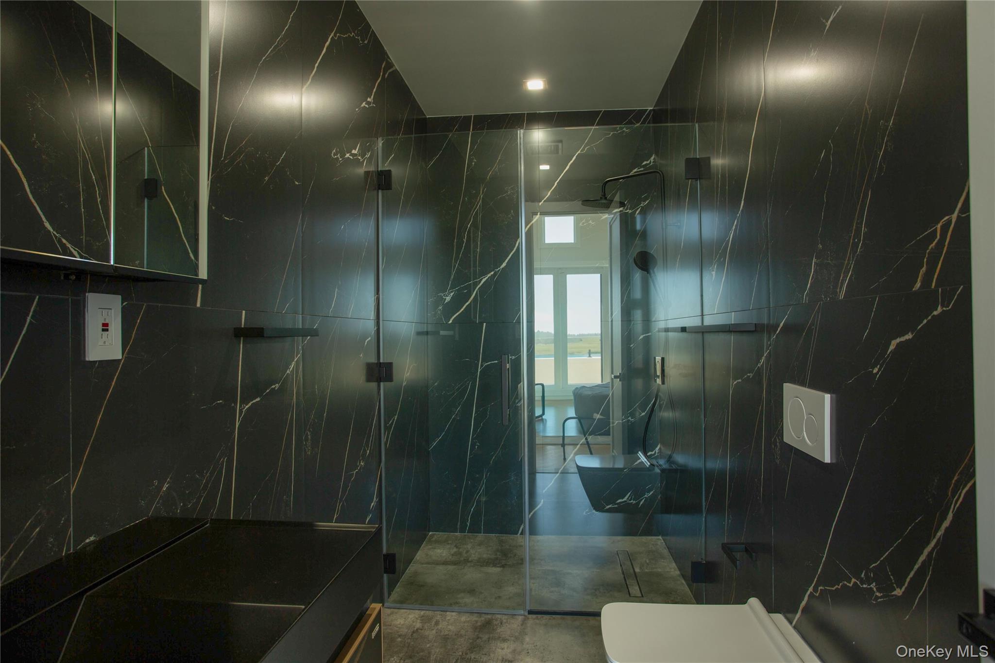 190 Curtis Road Woodmere, NY 11598 - Photo 30 of 45 Full bath featuring a marble finish shower and tile walls