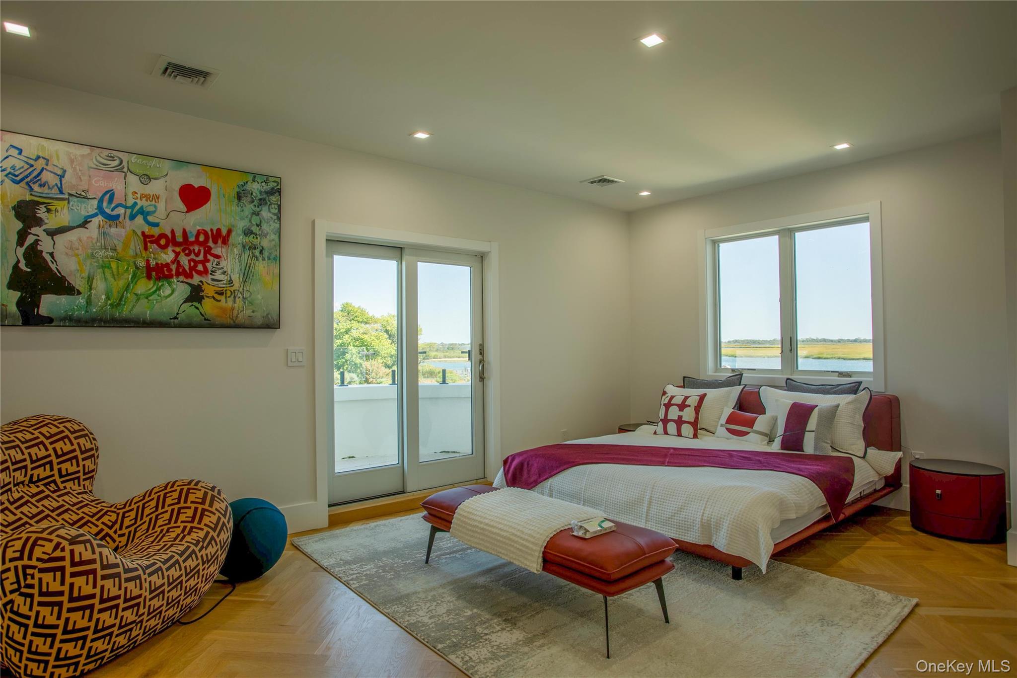 190 Curtis Road Woodmere, NY 11598 - Photo 32 of 45 Bedroom featuring recessed lighting, access to exterior, and a water view