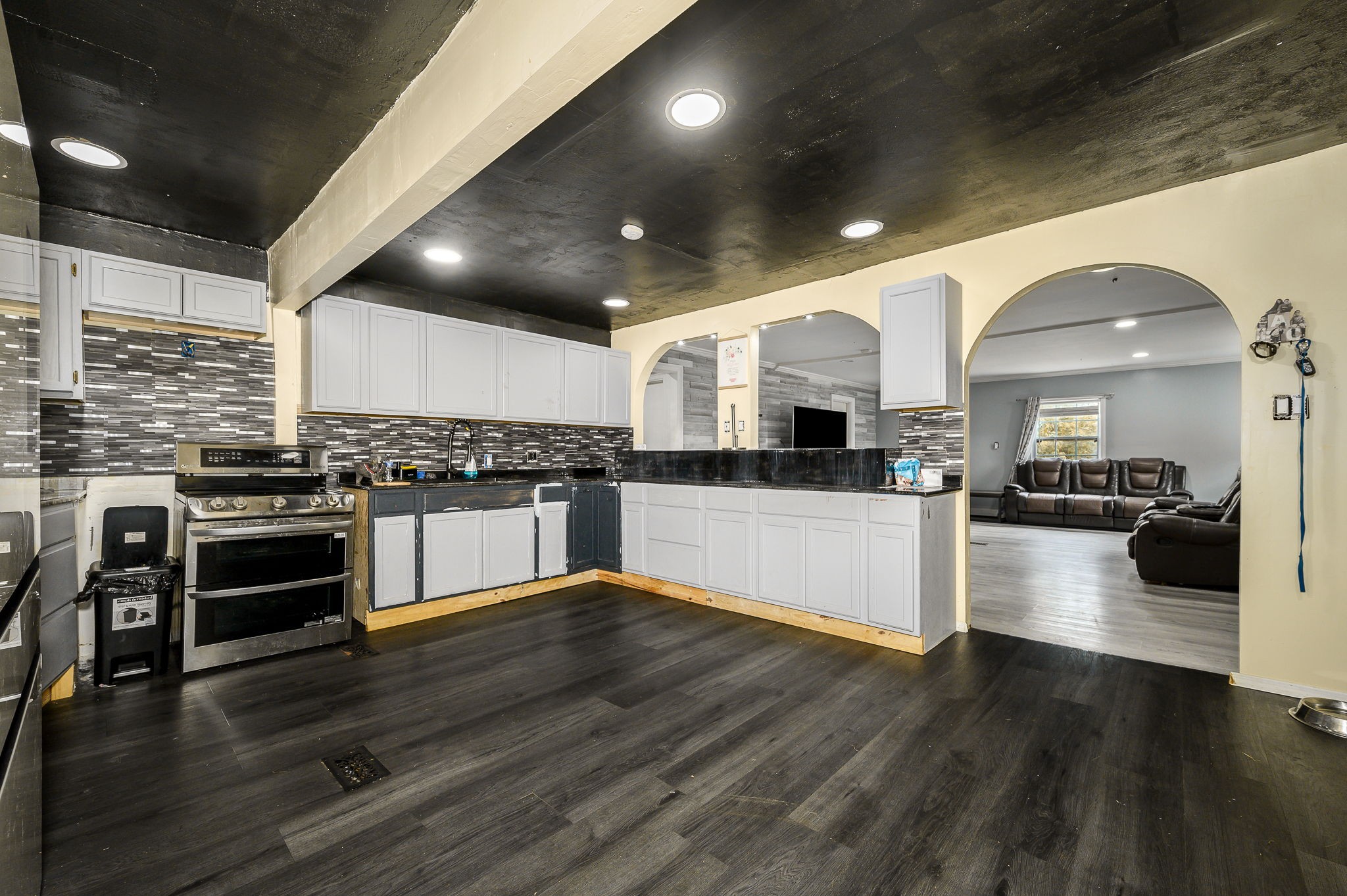 3198 Horn Springs Road Lebanon, TN 37087 - Photo 27 of 41 a kitchen with stainless steel appliances kitchen island granite countertop a stove and a refrigerator