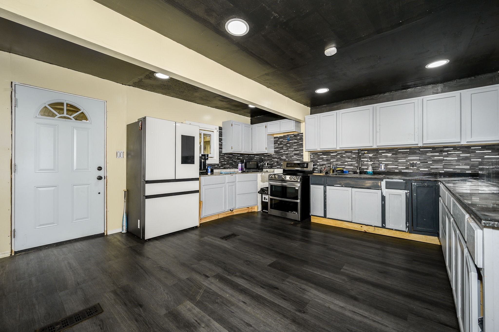 3198 Horn Springs Road Lebanon, TN 37087 - Photo 29 of 41 a kitchen with granite countertop a refrigerator and wooden floor