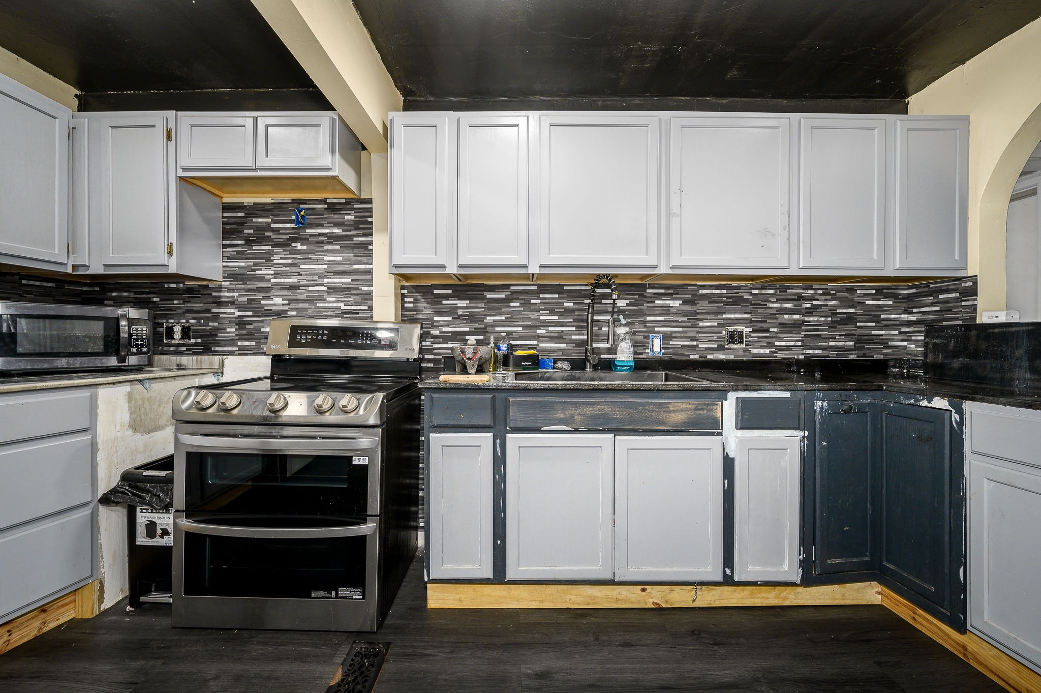3198 Horn Springs Road Lebanon, TN 37087 - Photo 30 of 41 a kitchen with stainless steel appliances granite countertop a stove a sink and a microwave