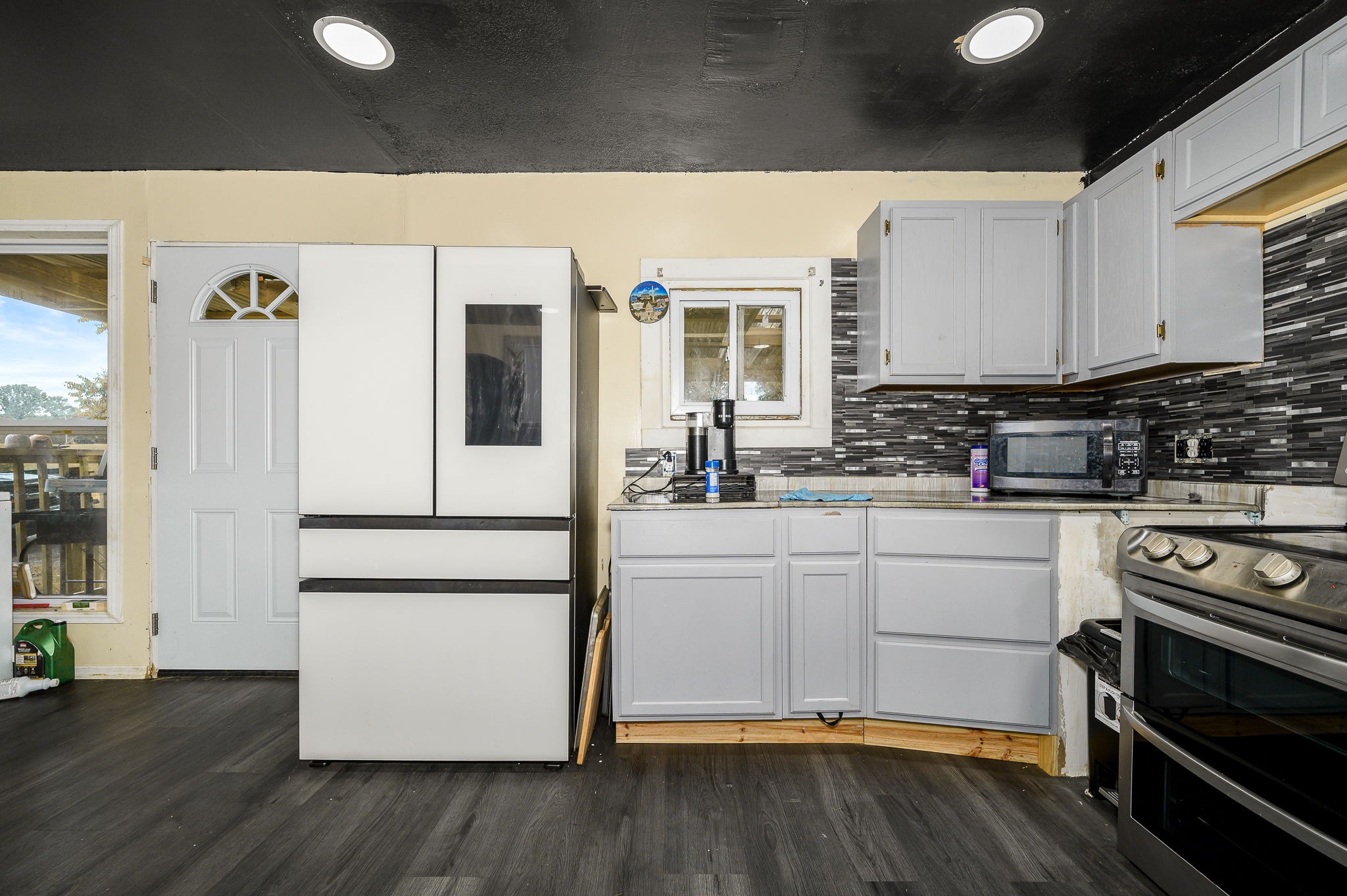 3198 Horn Springs Road Lebanon, TN 37087 - Photo 31 of 41 a kitchen with a refrigerator and white cabinets