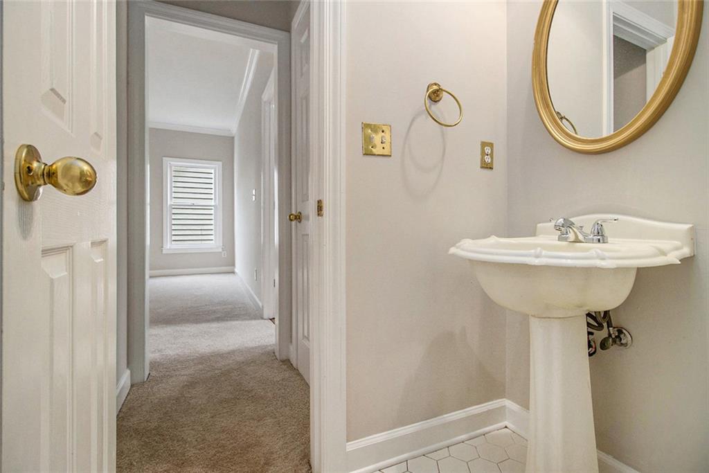 1463 Crescent Walk Decatur, GA 30033 - Photo 13 of 28 a bathroom with a sink and a mirror