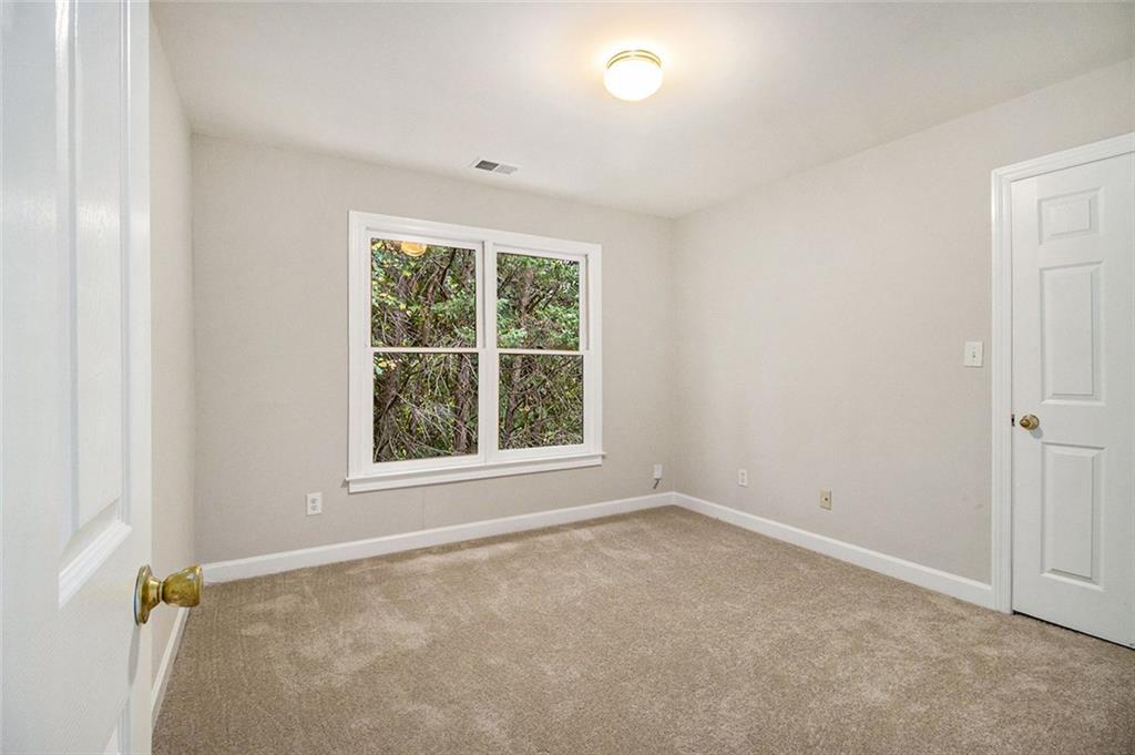 1463 Crescent Walk Decatur, GA 30033 - Photo 16 of 28 an empty room with a window