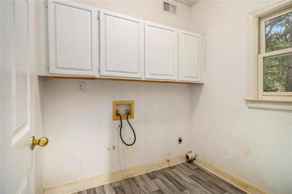 1463 Crescent Walk Decatur, GA 30033 - Photo 21 of 28 a view of a storage and utility room with racks on the wall