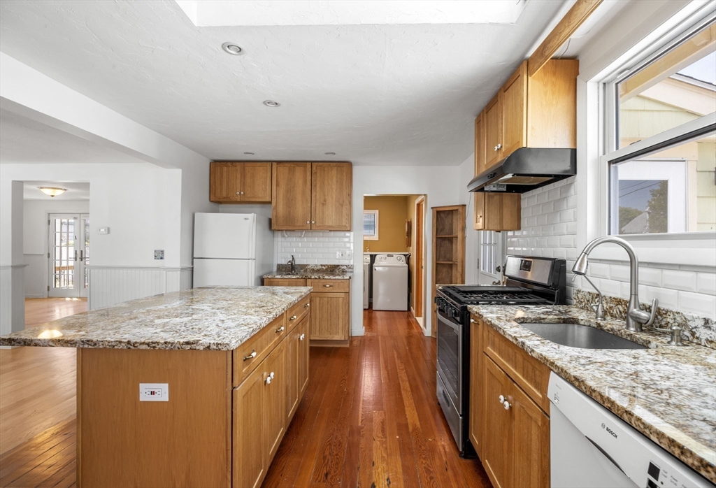 7 Grove Street Wareham, MA 02558 - Photo 8 of 41 a kitchen with stainless steel appliances granite countertop a sink stove and refrigerator