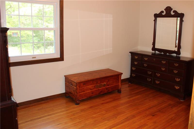 118 West Starz Road Cheswick, PA 15024 - Photo 11 of 18 Bedroom 2 has two closets and beautiful hardwood floors. Freshly painted!