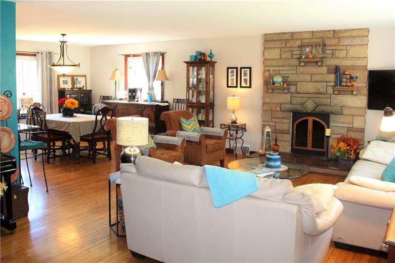 118 West Starz Road Cheswick, PA 15024 - Photo 3 of 18 Open floor plan-living room and dining room with wood burning fireplace