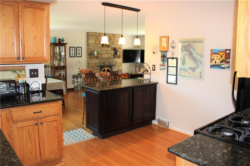 118 West Starz Road Cheswick, PA 15024 - Photo 8 of 18 Kitchen with breakfast bar, granite counter tops, and brand new dishwasher.