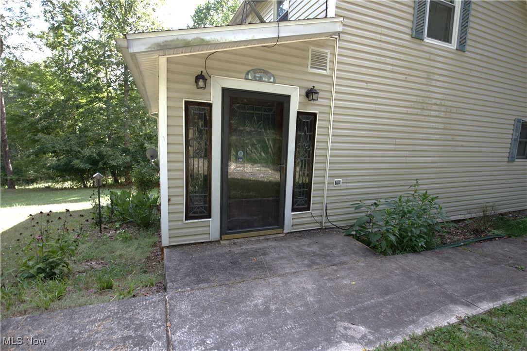 22760 Roy Croy Road Senecaville, OH 43780 - Photo 32 of 46 Property rear entrance with a patio area