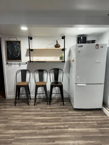 a white refrigerator freezer sitting in a kitchen