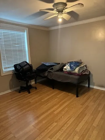 a living room with furniture and a air conditioner vent