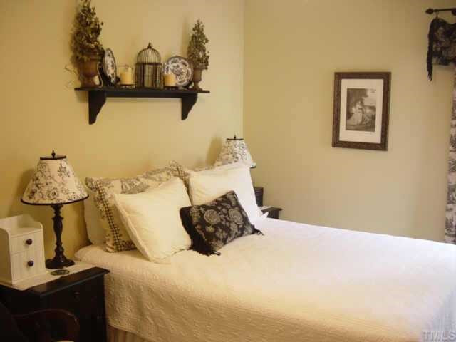5252 Fairmead Circle Raleigh, NC 27613 - Photo 7 of 12 Bedroom 2 makes for a great guest bedroom, and this one has been decorated with your guests in mind! Closet features Closet Maid shelving. Other