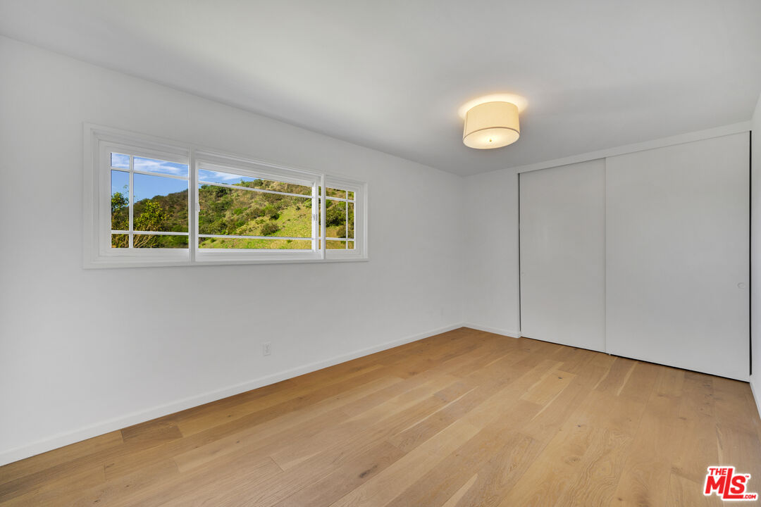 1758 Clear View Drive Beverly Hills, CA 90210 - Photo 28 of 33 an empty room with a window