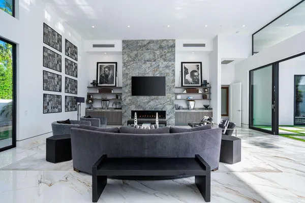 a living room with fireplace furniture and a fireplace